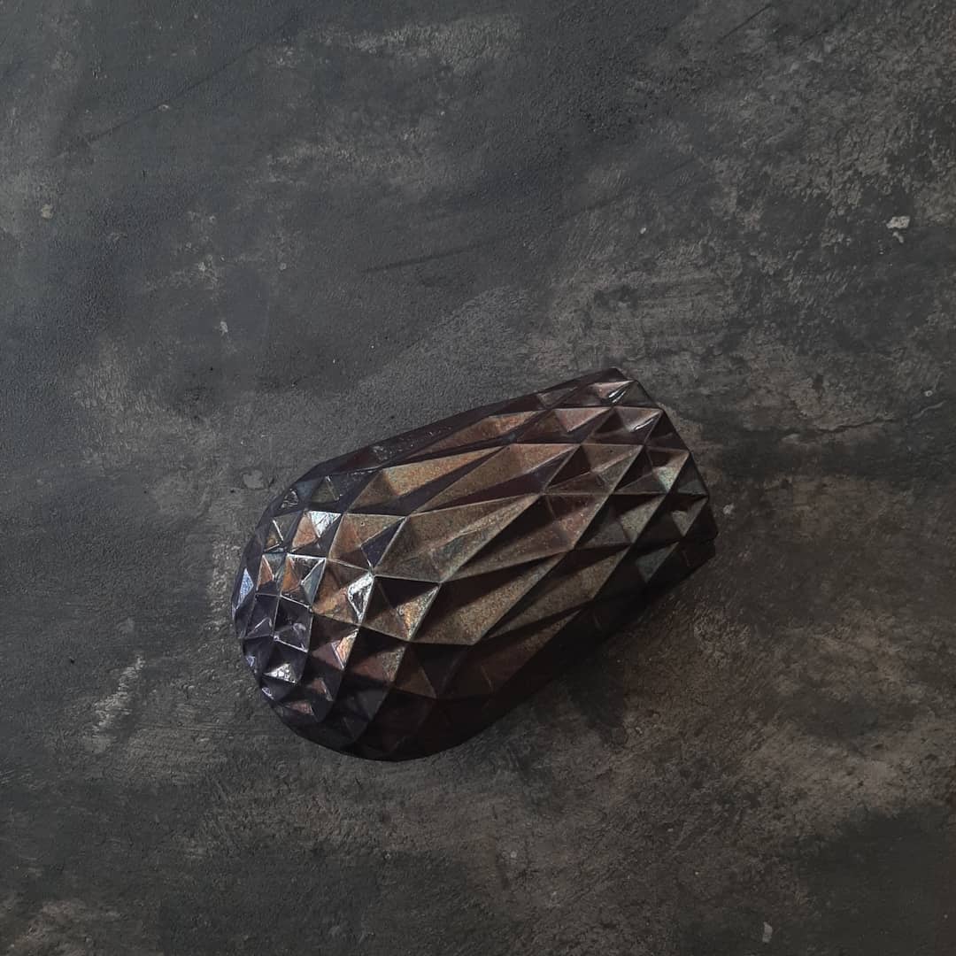 Faceted vase in black lustre glaze